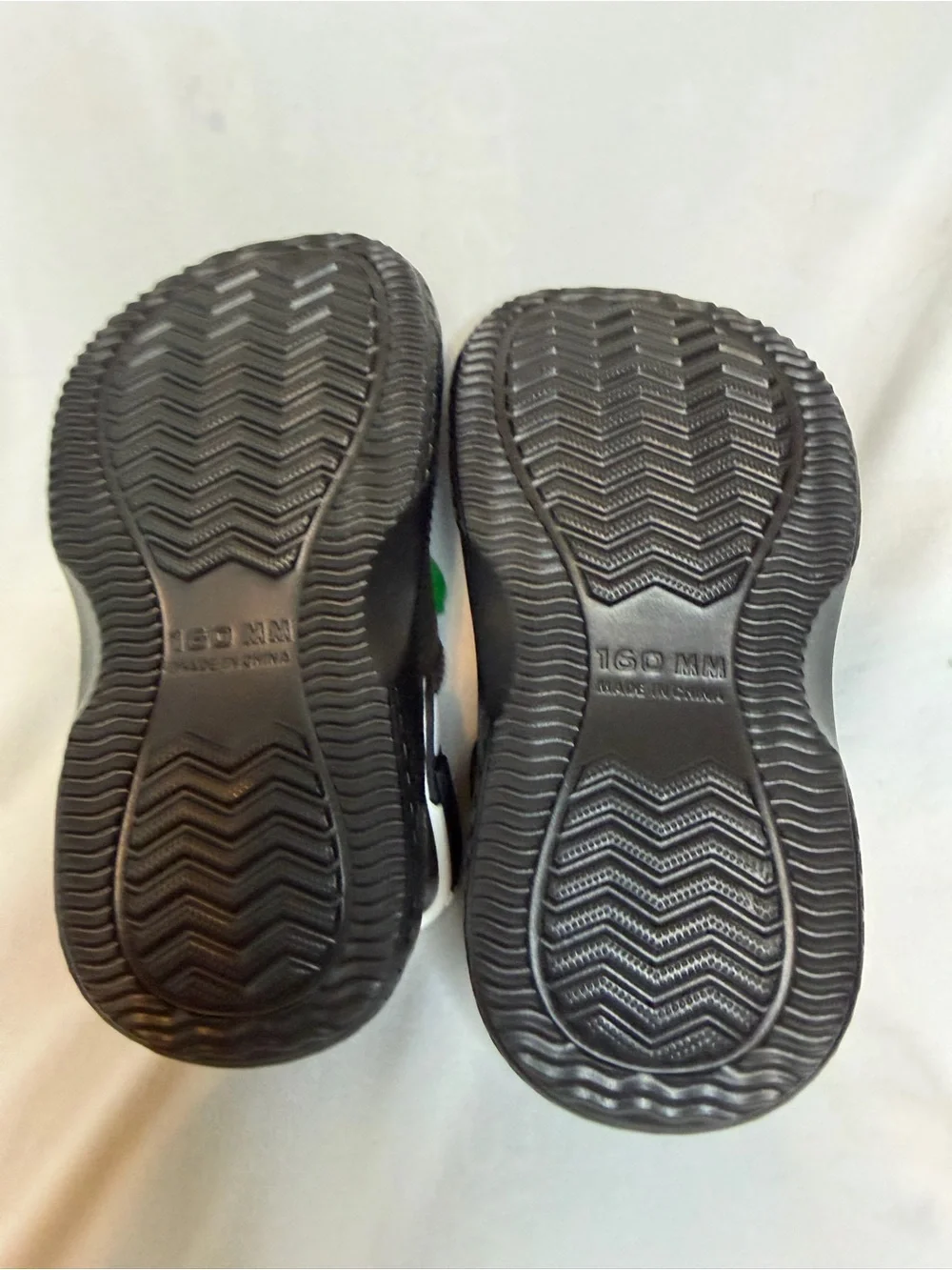 Black Kids Clog Sandals with Green Dinosaur Charms